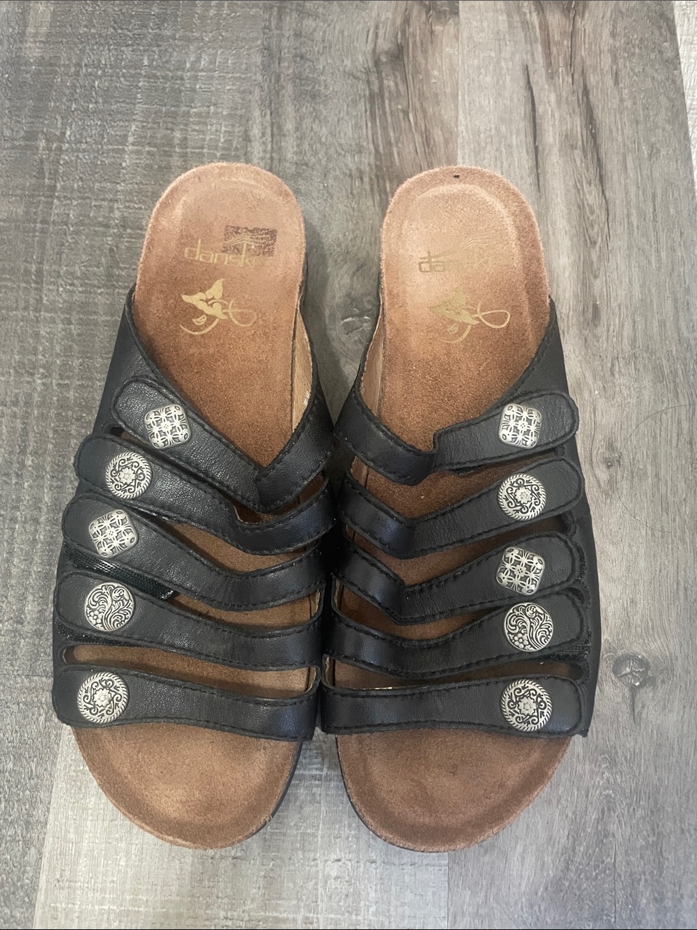 Dansko Janie Black Leather Slip-On Sandals with Decorative Silver Buttons